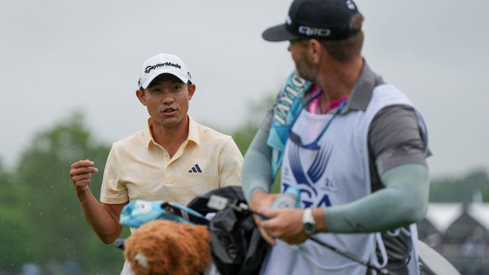 Collin Morikawa with his caddie JJ