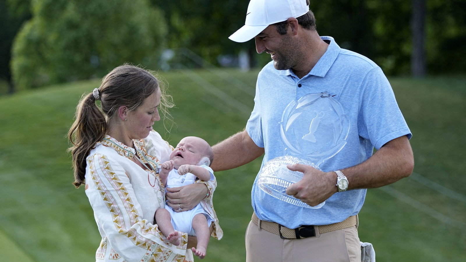 Scottie Scheffler with his wife and son
