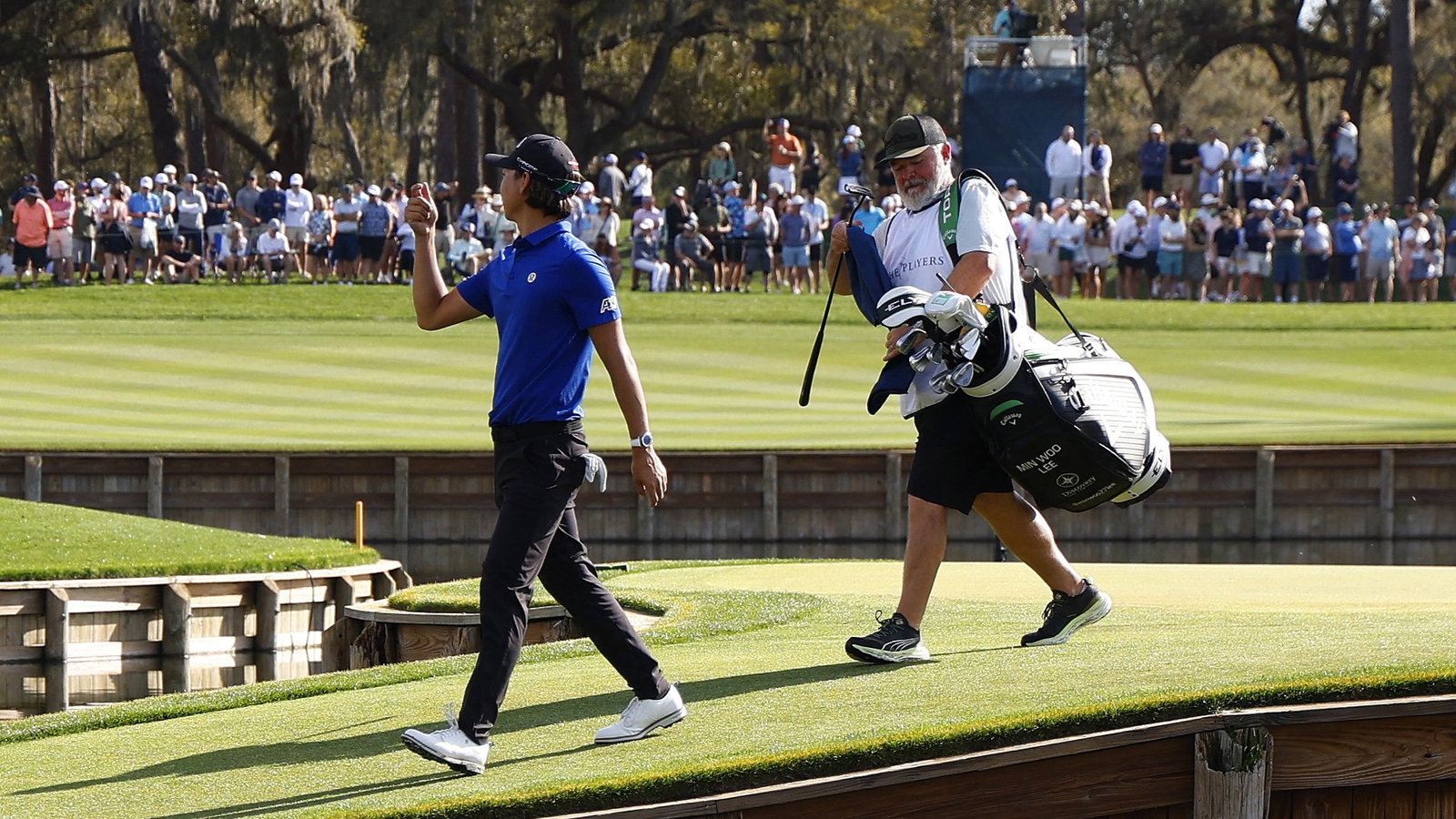 Min Woo Lee and his caddie