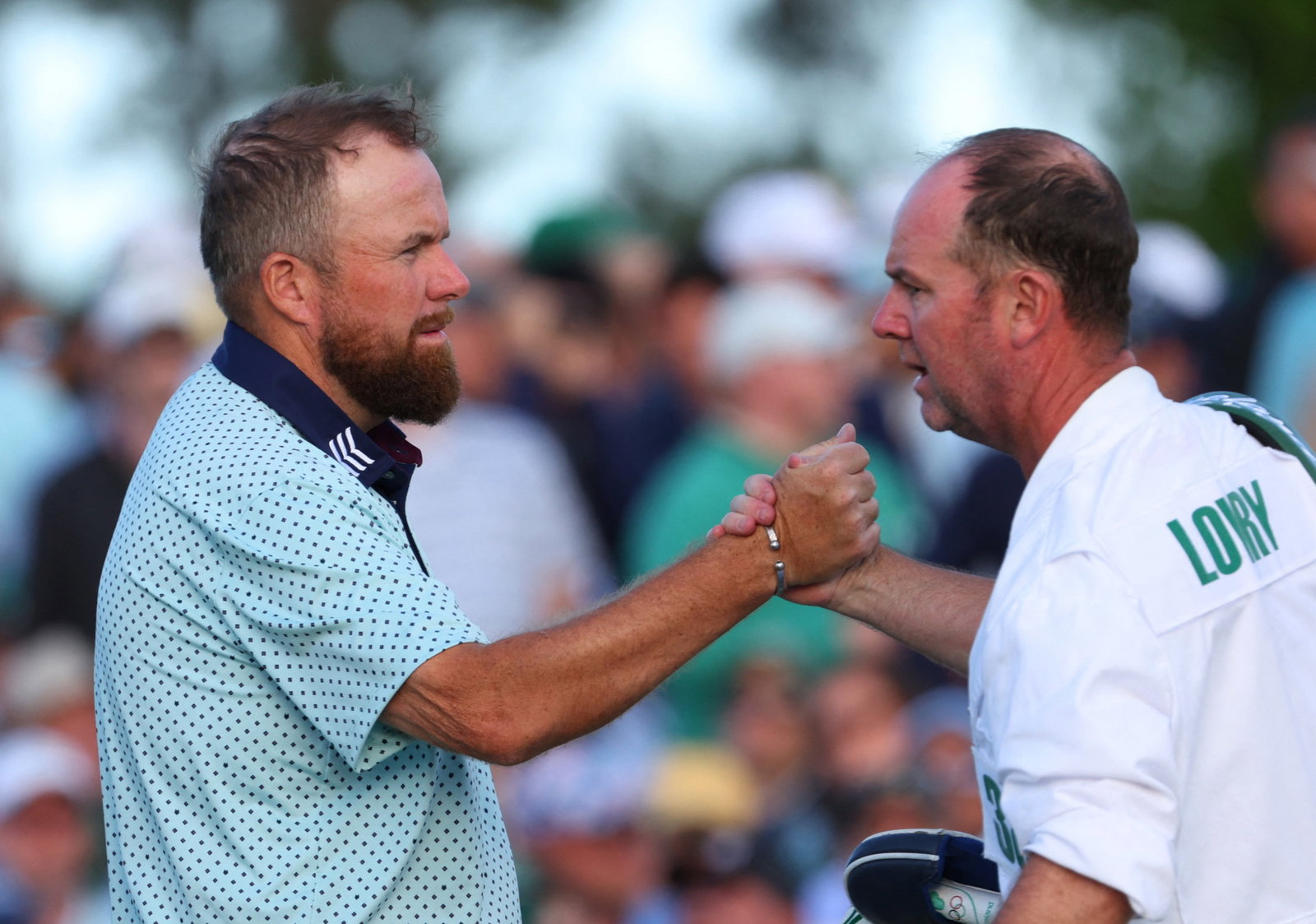 Shane Lowry and his caddie