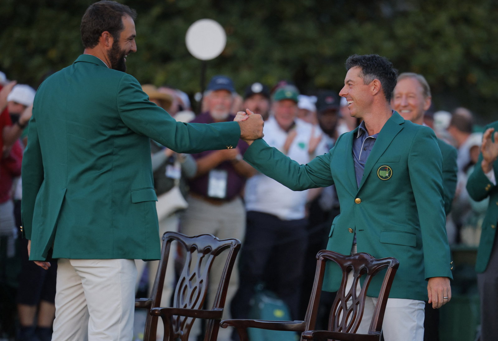 Scheffler presents Green Jacket to McIlroy