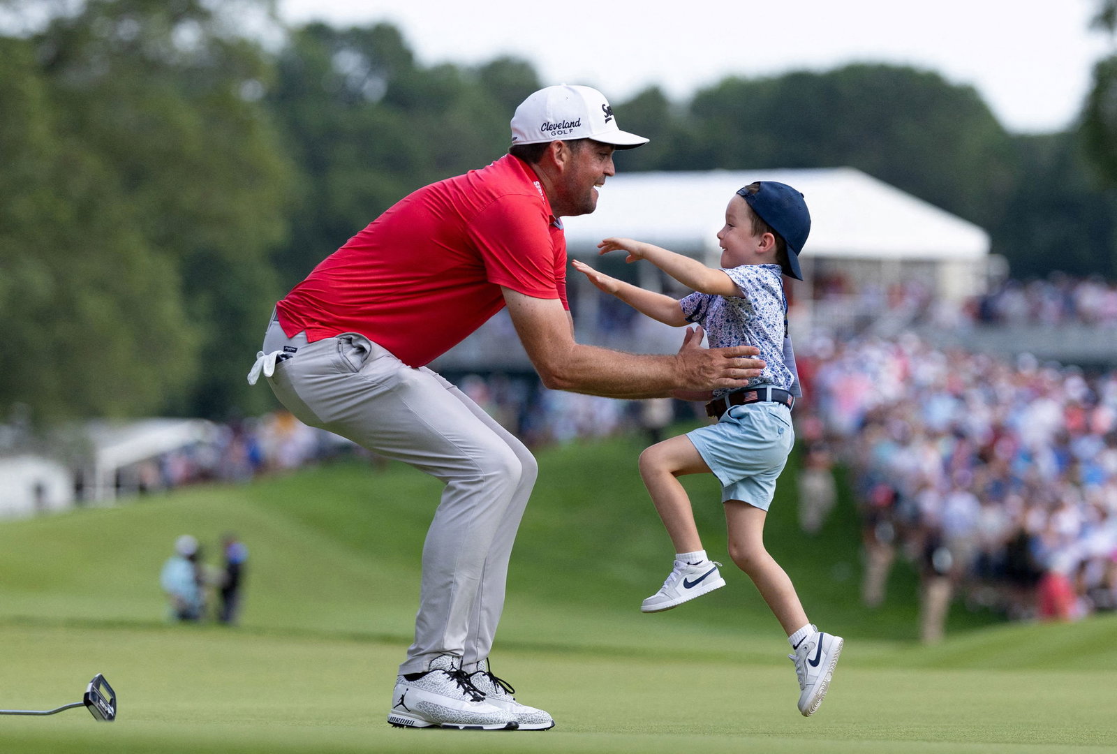 Bradley celebrates victory with his son
