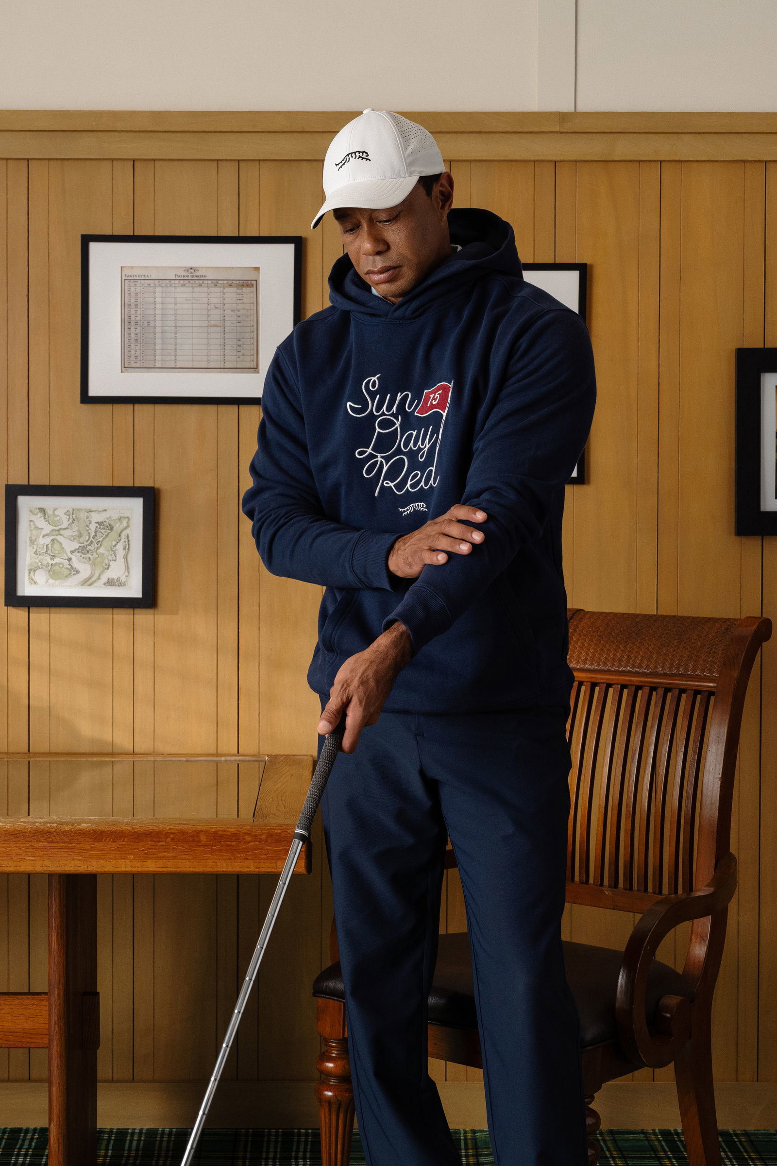 Woods wears a new hoodie from the collection