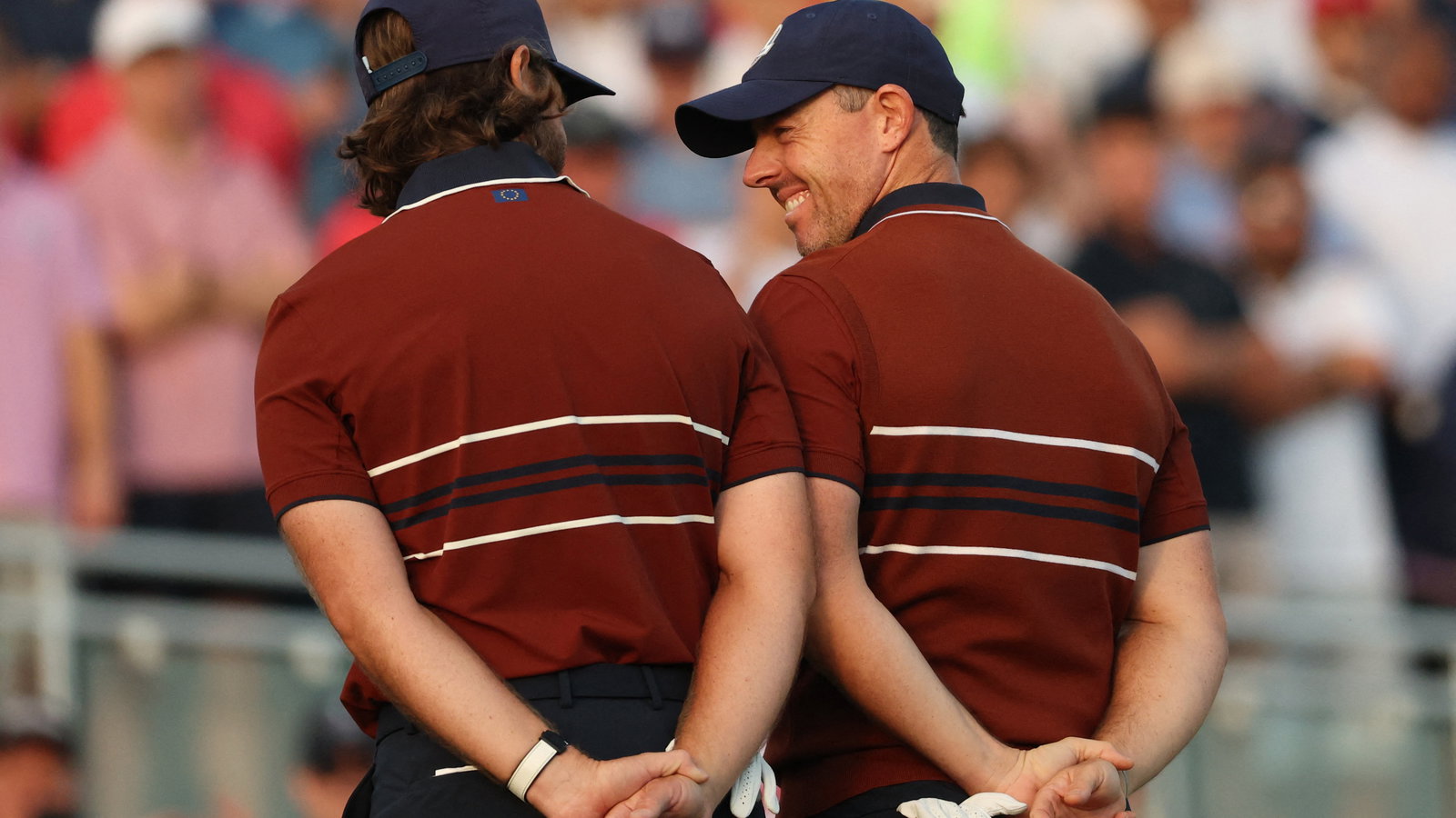 McIlroy looks at Fleetwood on the 1st tee