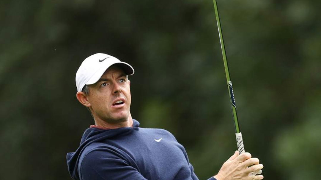 McIlroy plays a shot with his new TaylorMade MG5 wedges