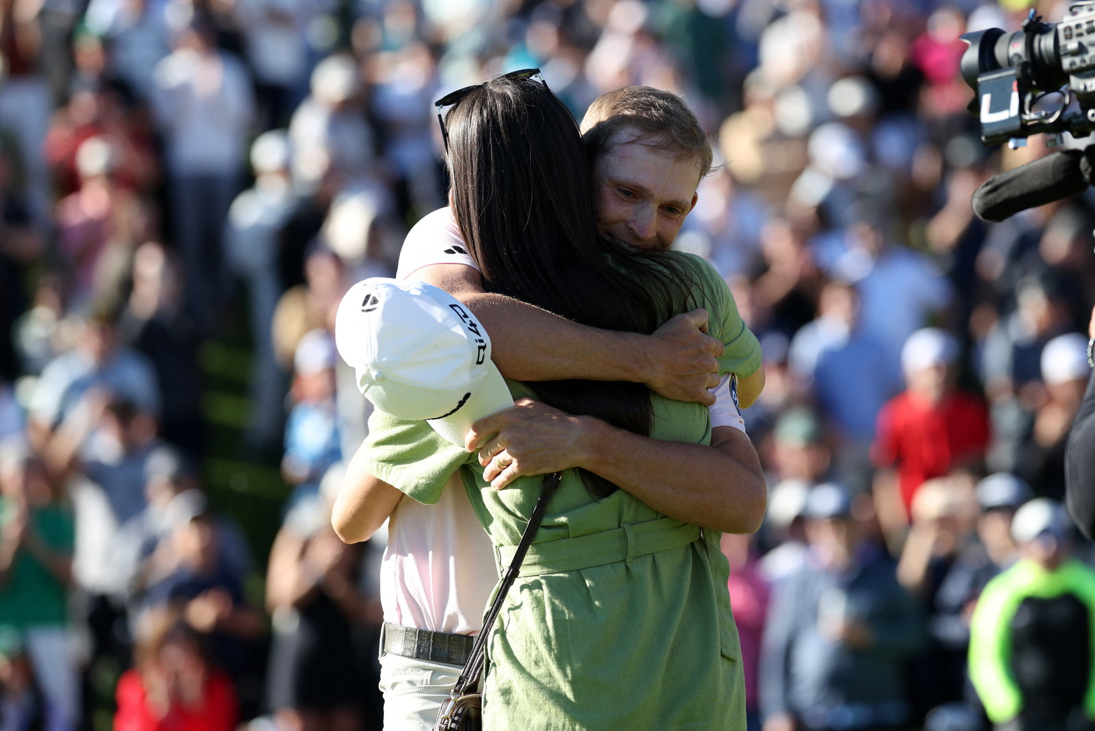 Jacob Bridgeman celebrates winning the Genesis Invitational with wife Haley