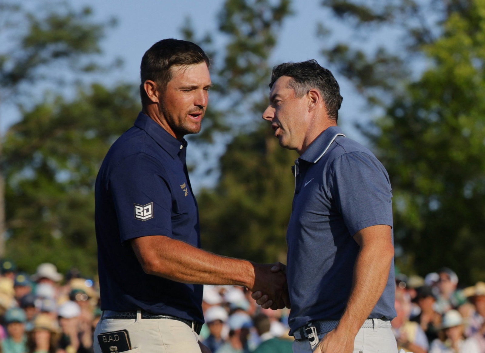 Rory McIlroy and Bryson DeChambeau shake hands at the 2025 Masters
