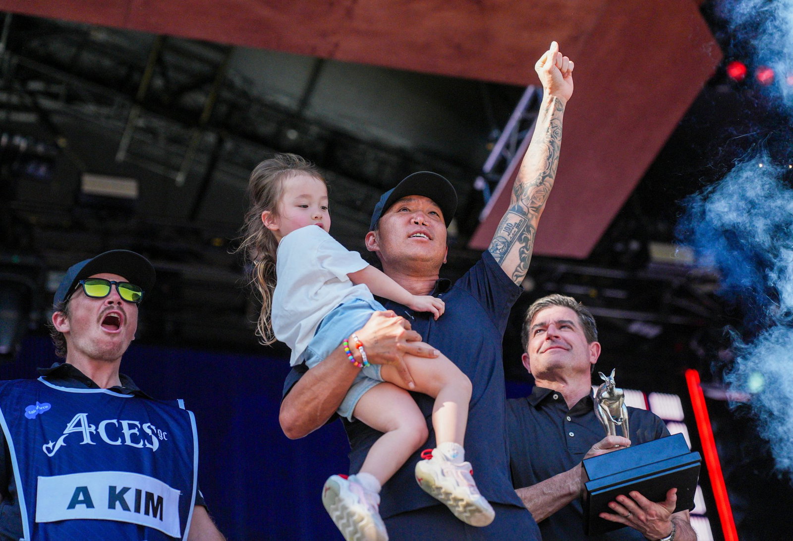 Kim celebrates with his daughter