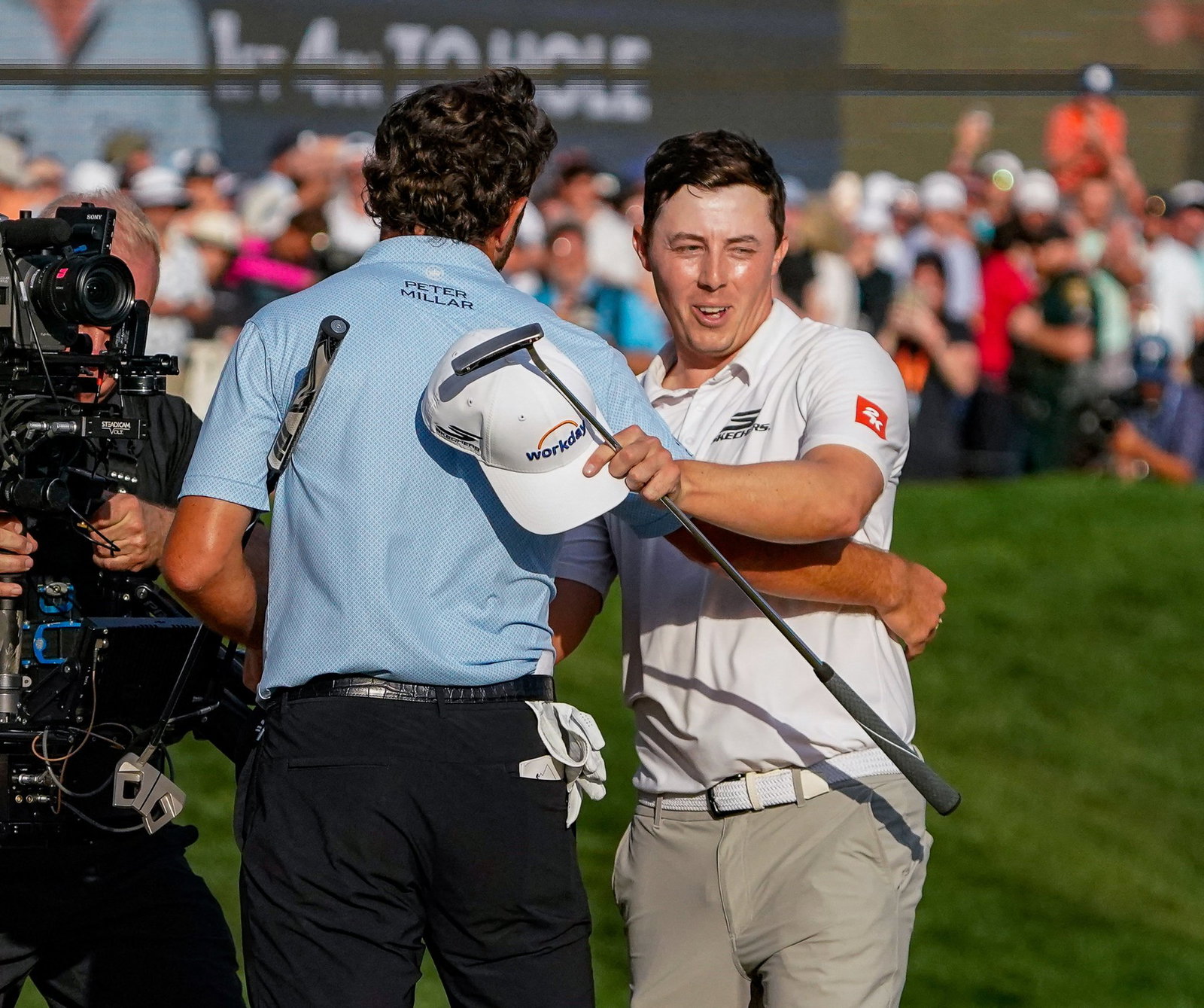 Cameron Young and Matthew Fitzpatrick on the 18th at Sawgrass