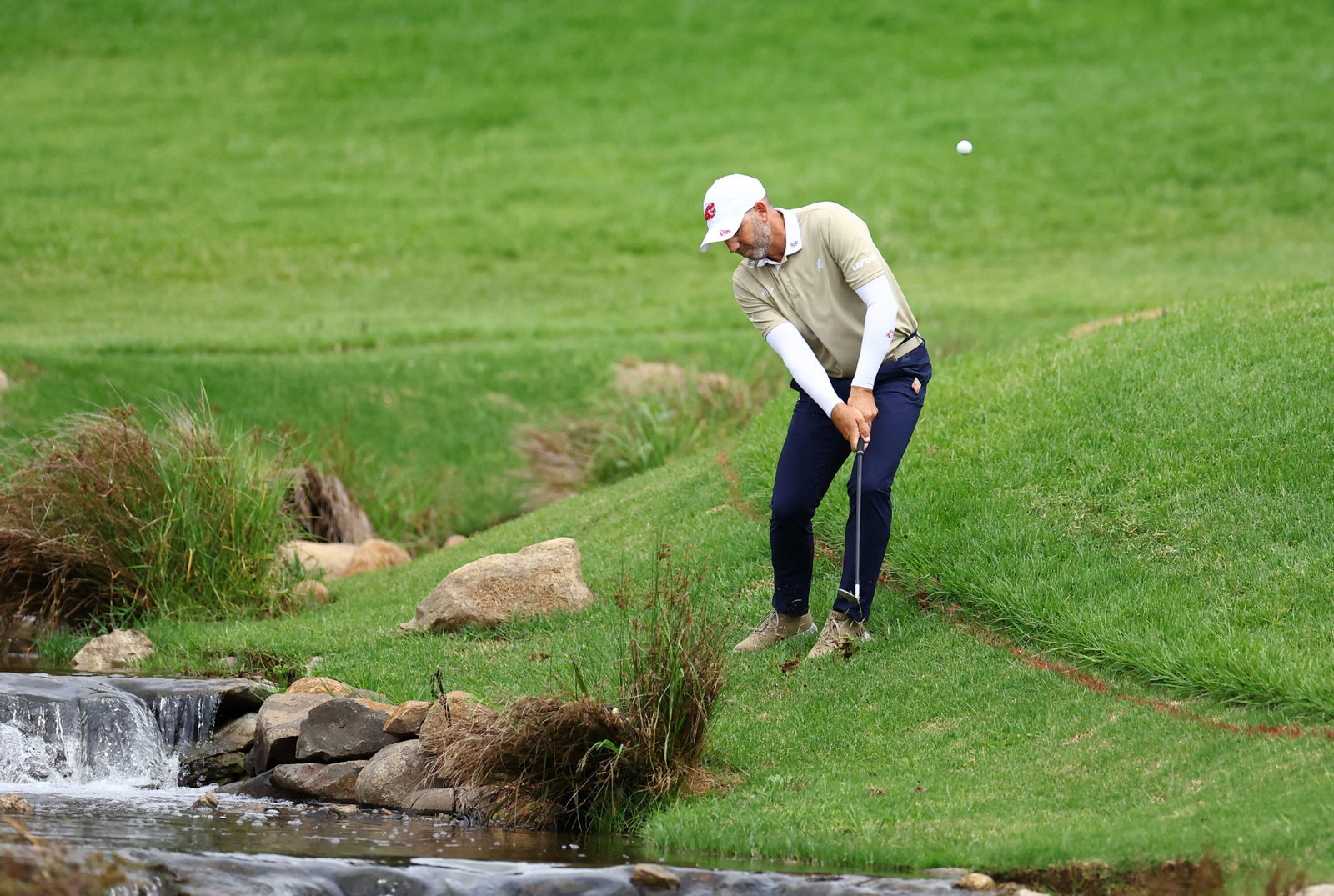 Touching the ground in penalty area or bunker
