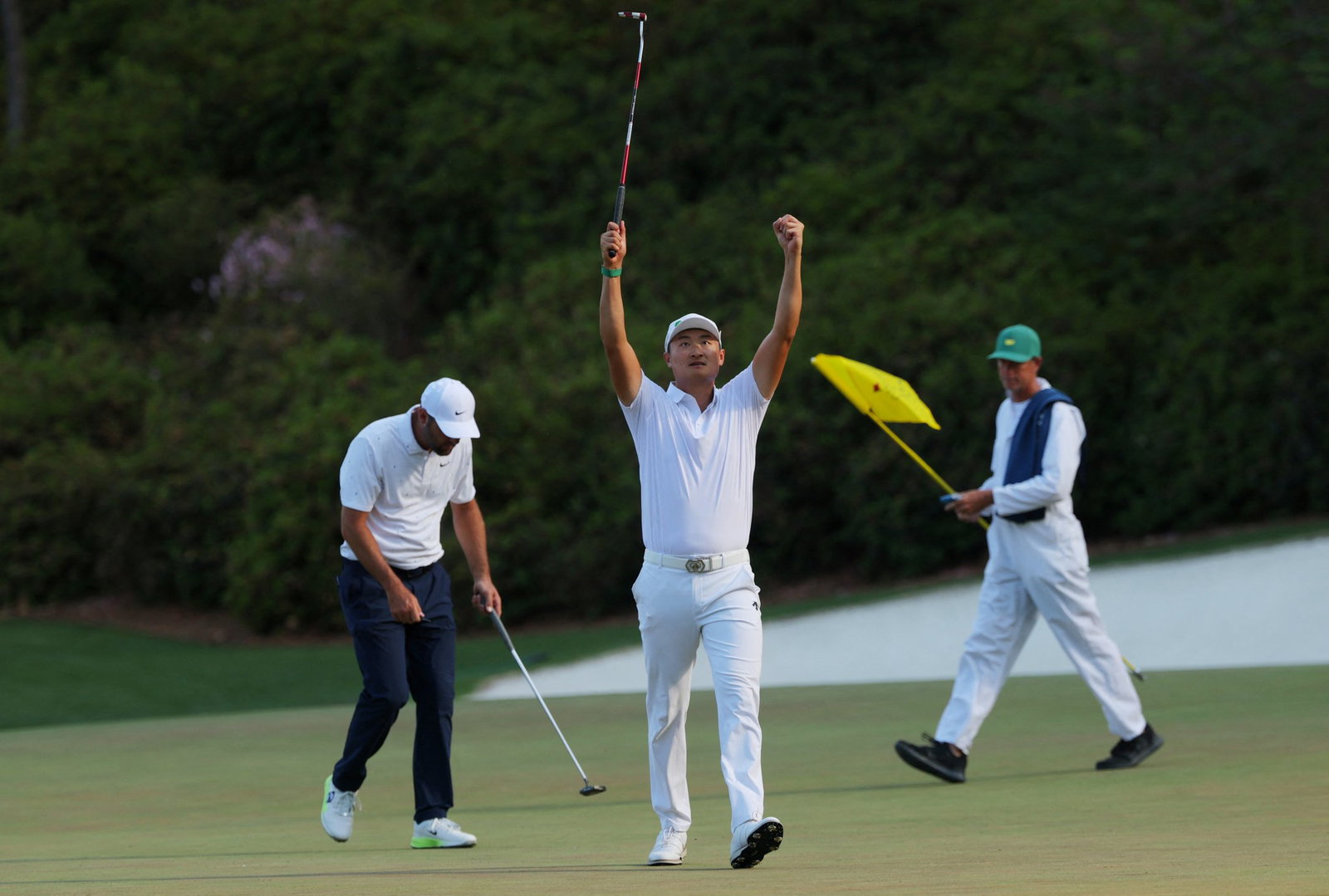 Li walking off the 13th green
