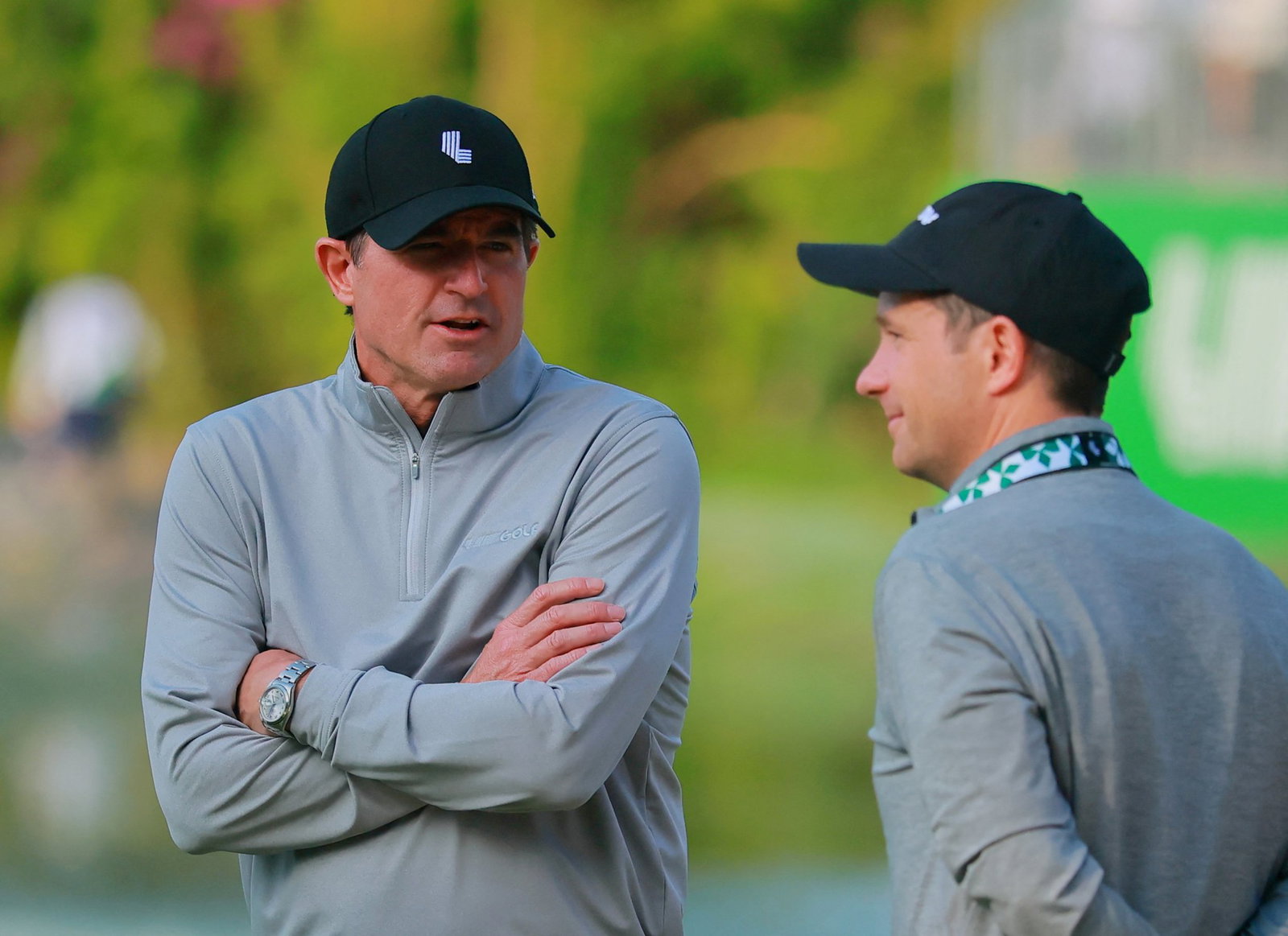 LIV Golf CEO Scott O'Neil (left)