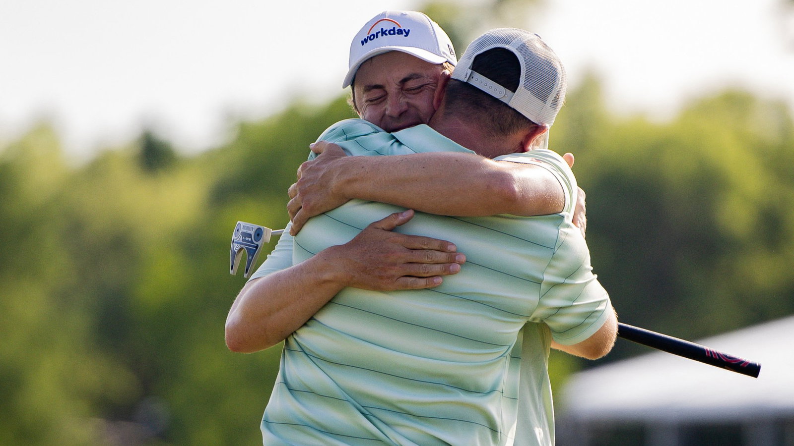 Brotherly Arms: Matt and Alex celebrate on 18