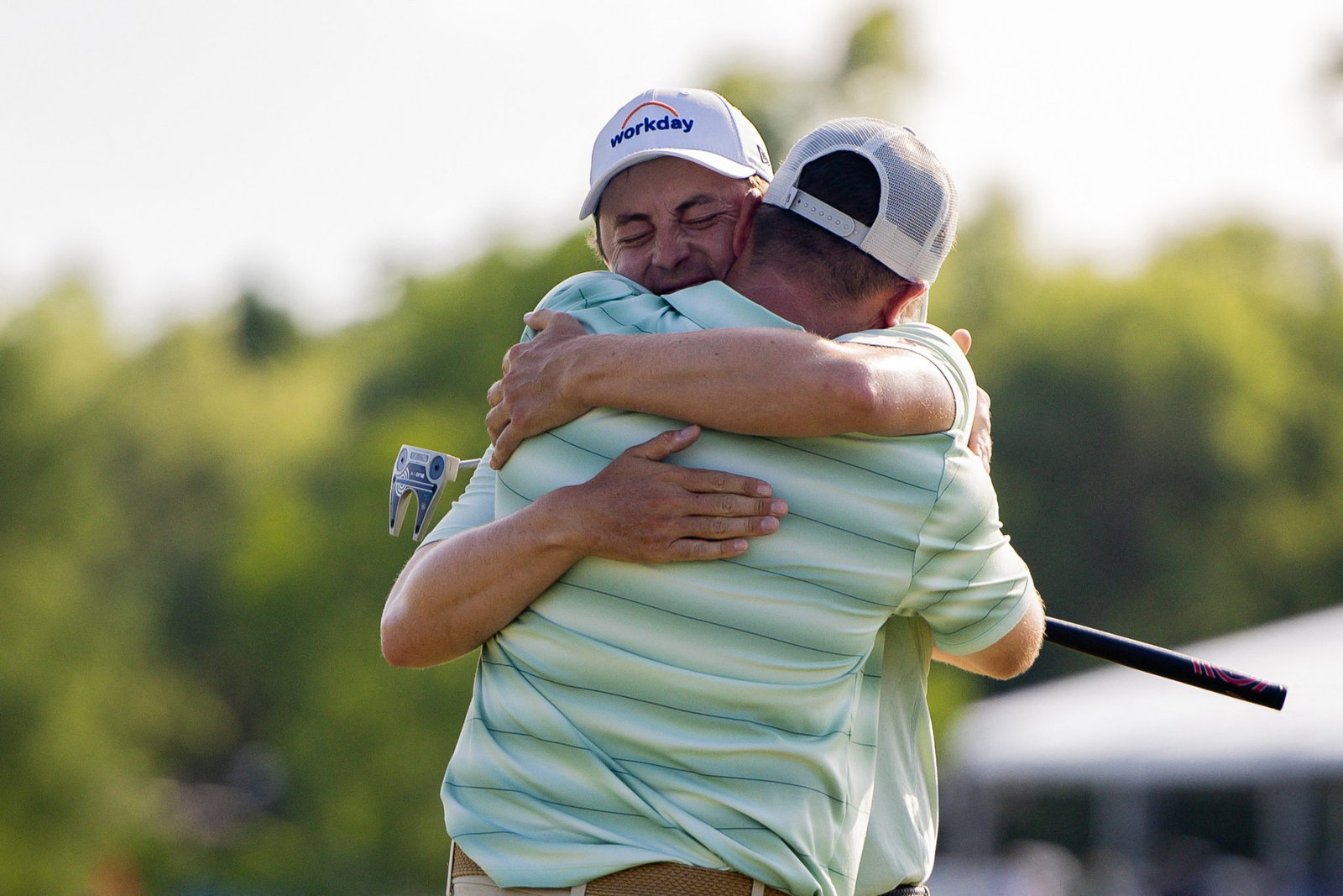Brotherly Arms: Matt and Alex celebrate on 18