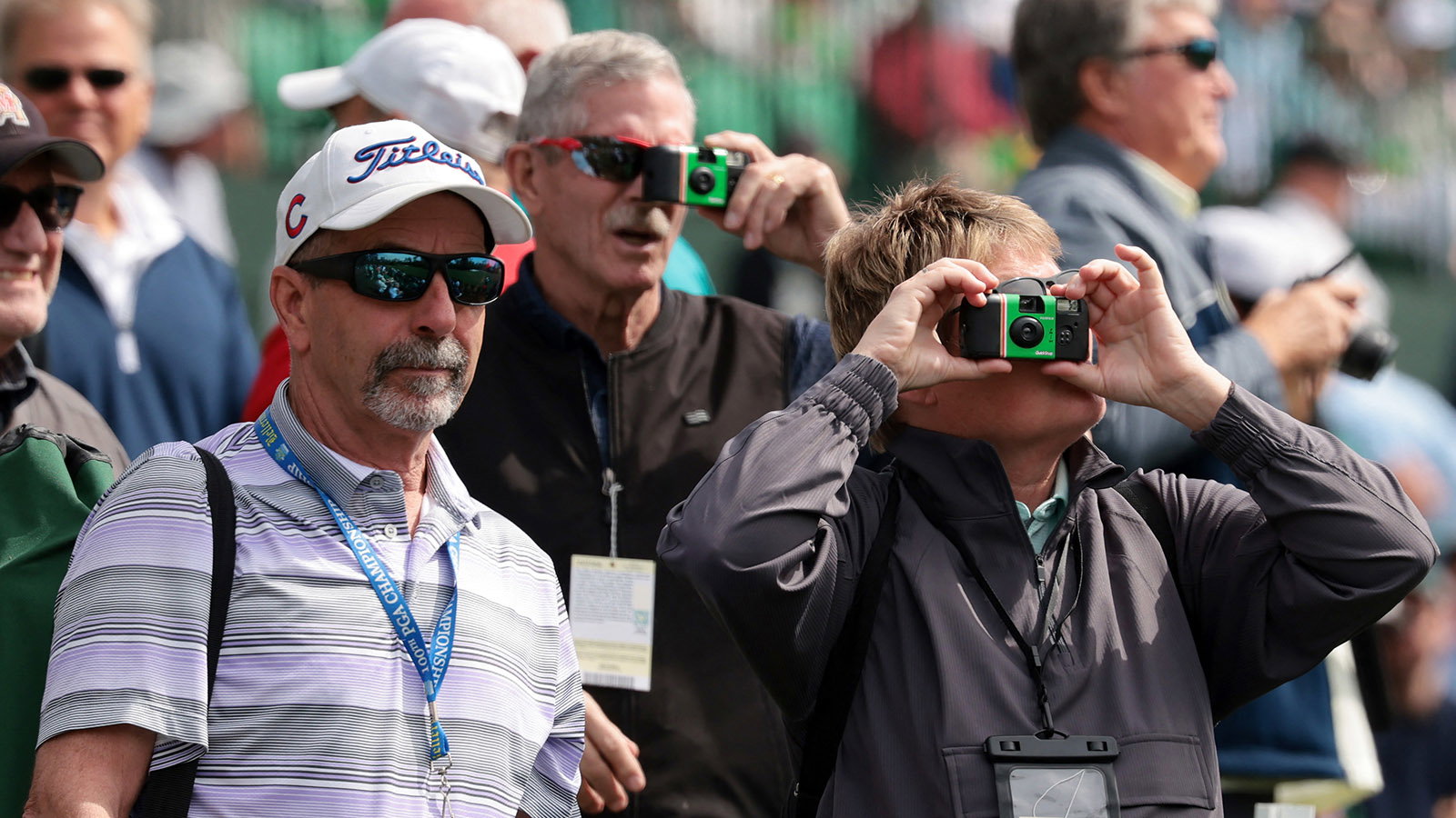 Patrons take photos with permitted cameras on Tuesday at Augusta National. Image: Reuters