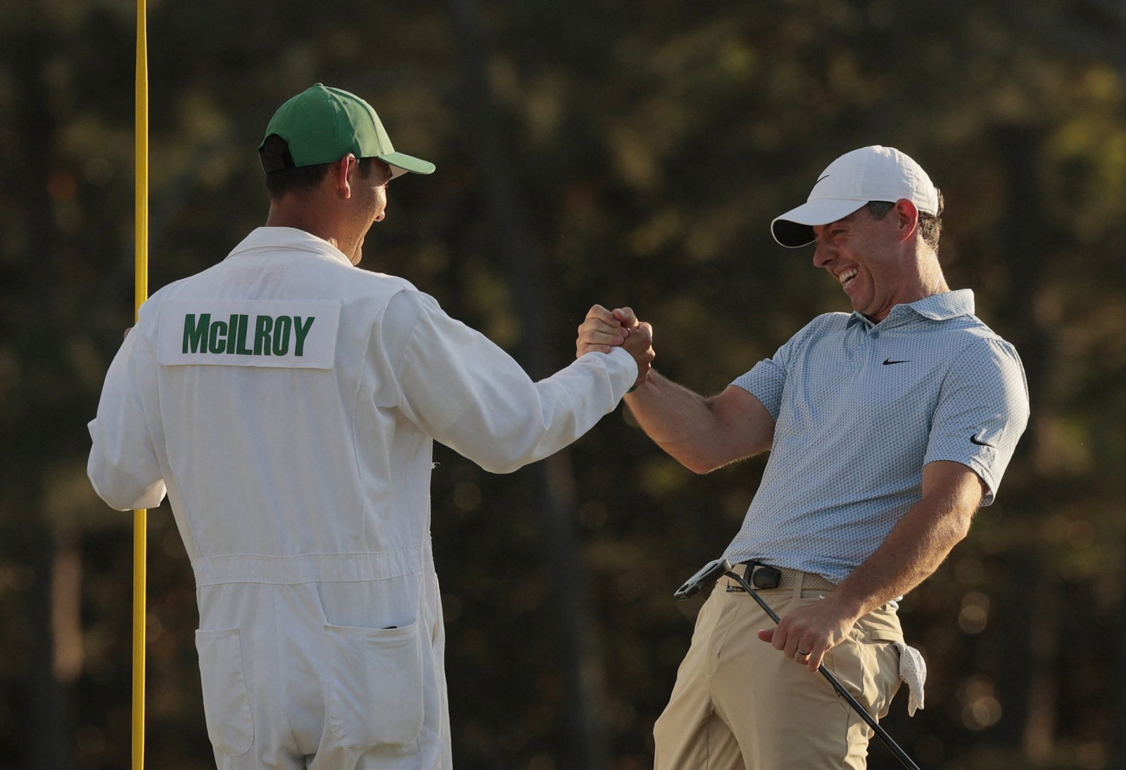 Rory celebrates with caddie Harry at The Masters