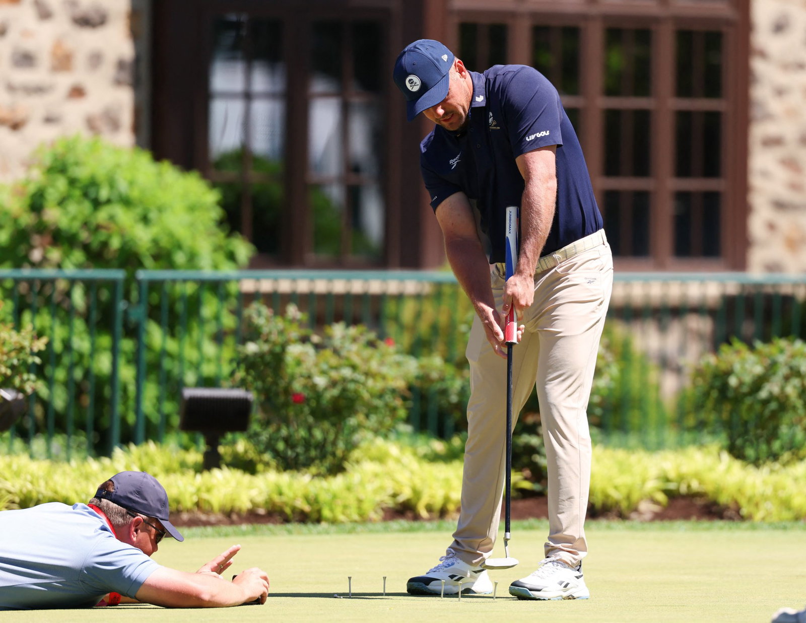 DeChambeau in practice mode at Aronimink