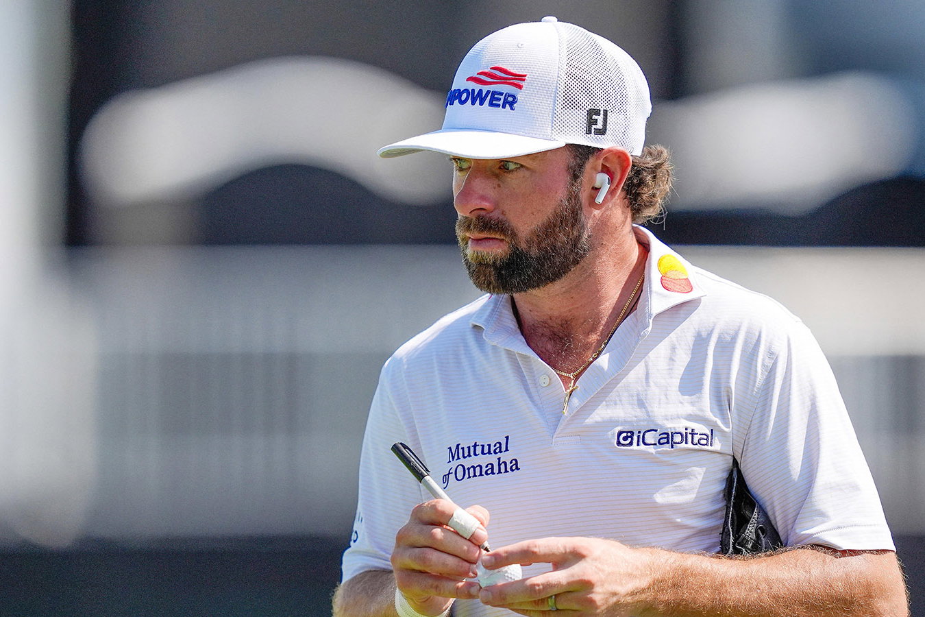 Cameron Young marks his ball before the first round of the Cadillac Championship. Image: Reuters