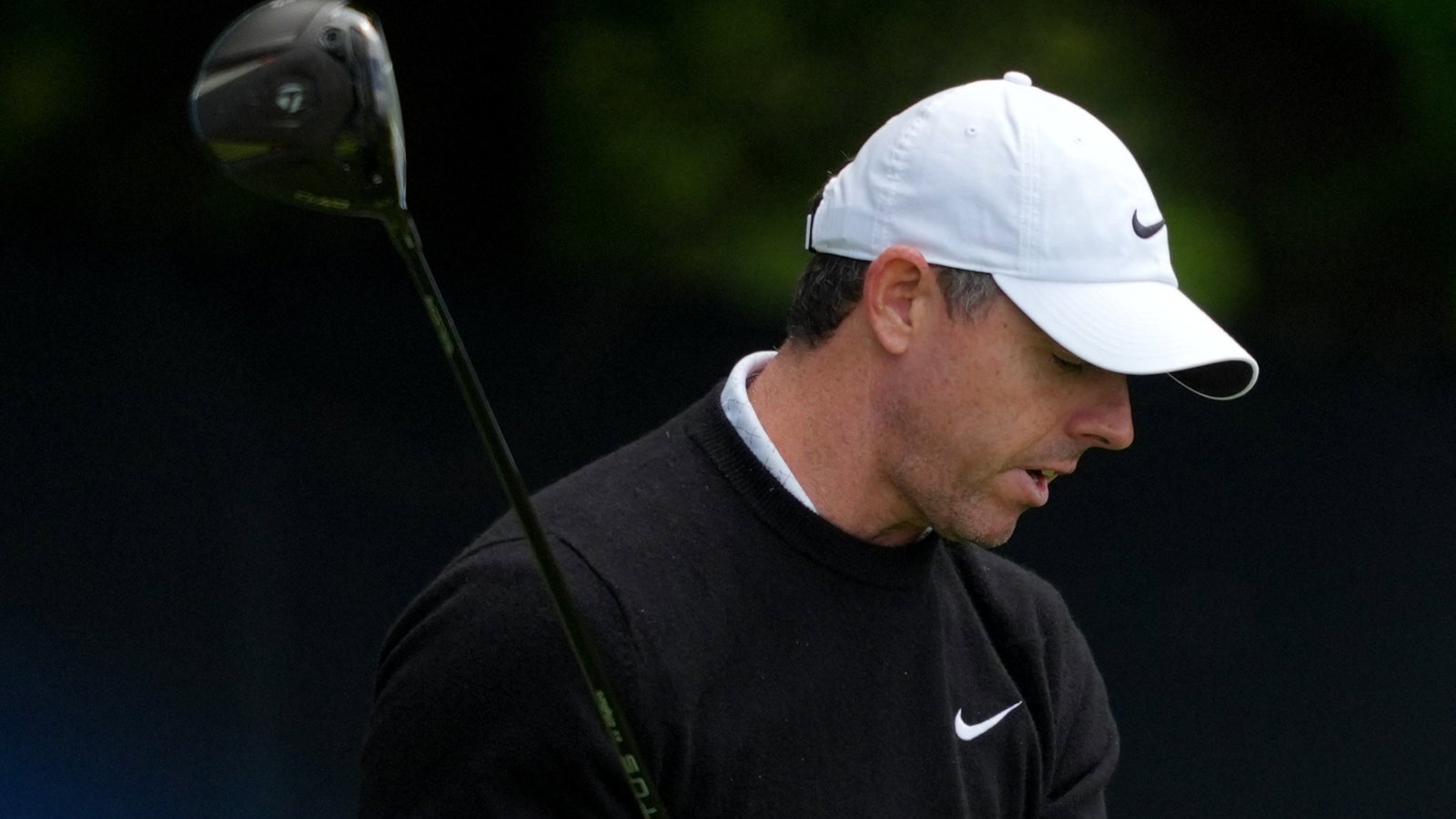 Rory McIlroy reacts angrily on the fourth tee 