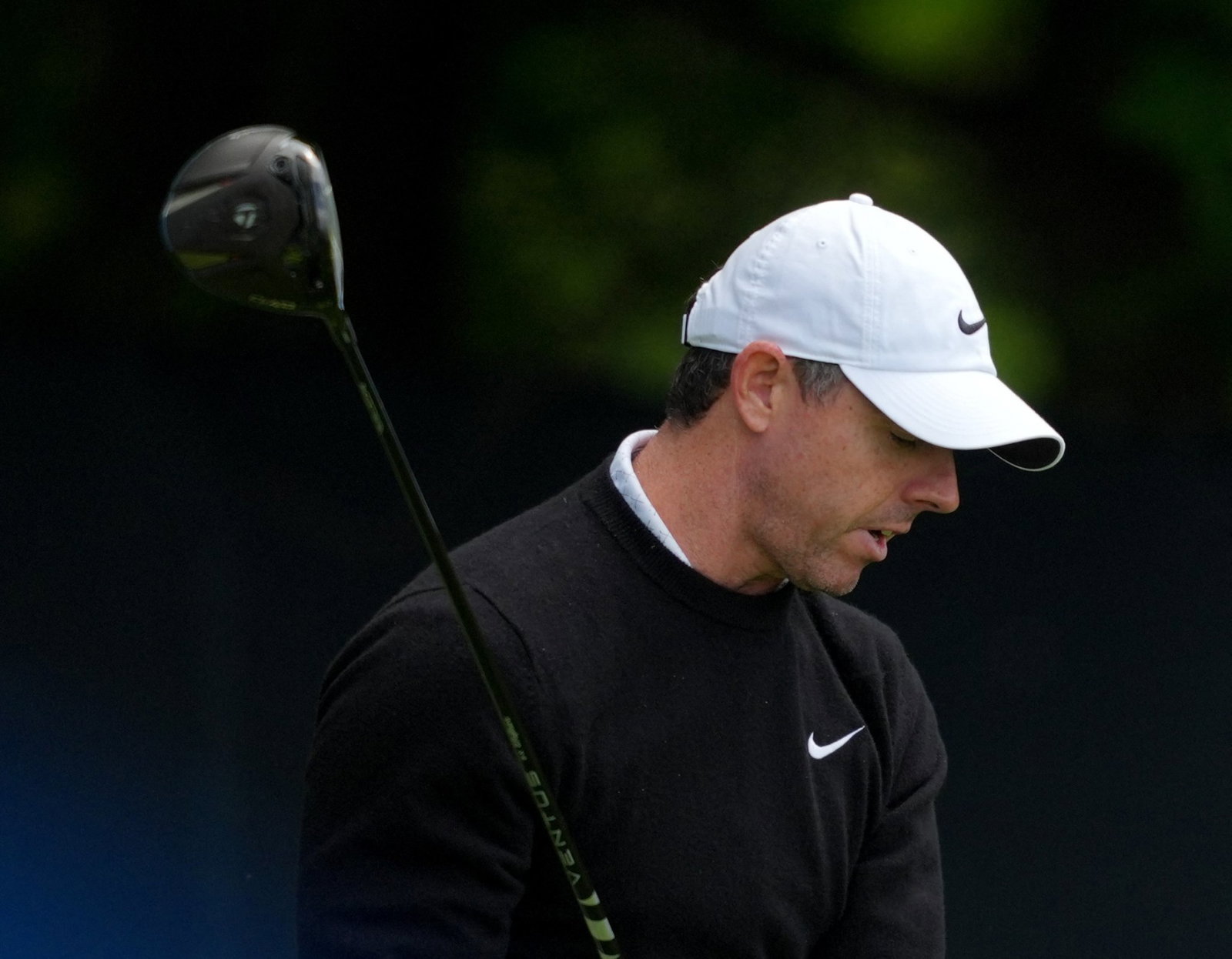 Rory McIlroy reacts angrily on the fourth tee 