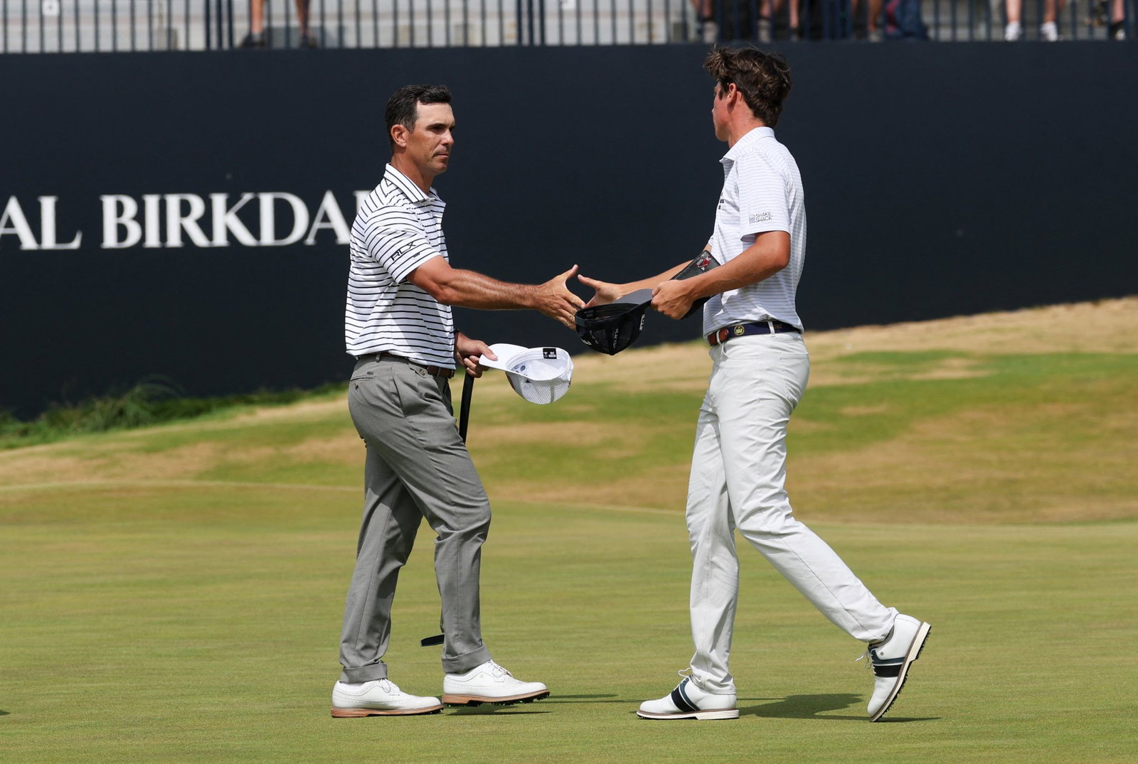 Howell shakes hands with Horschel at The Open