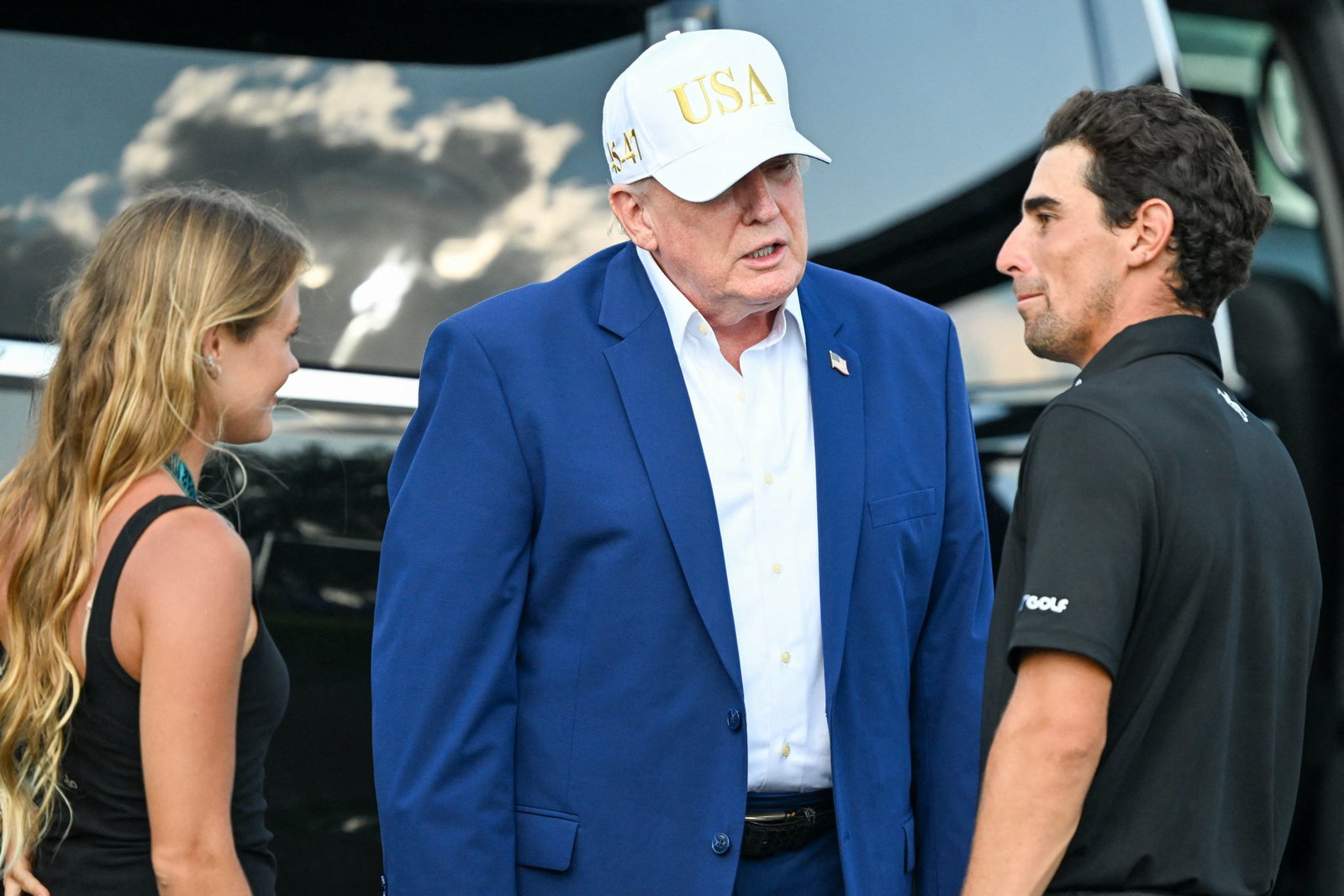 Donald Trump speaks to Joaquin Niemann after he claimed his ninth LIV title