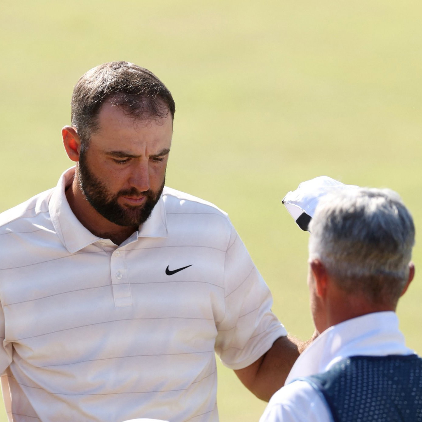 Scheffler with caddie Scott