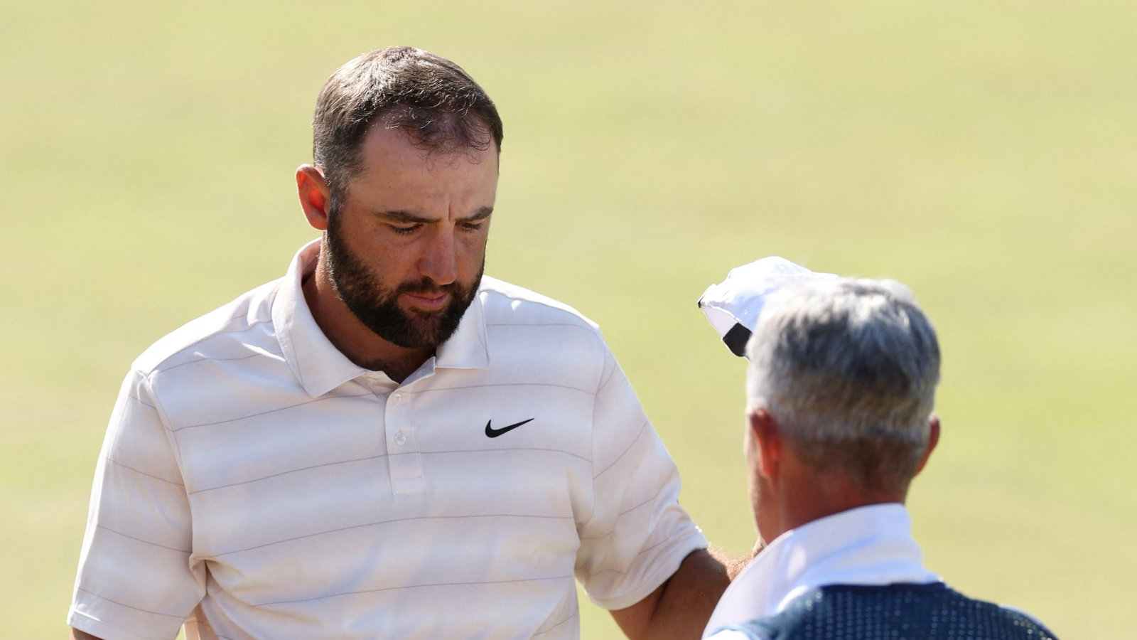 Scheffler with caddie Scott