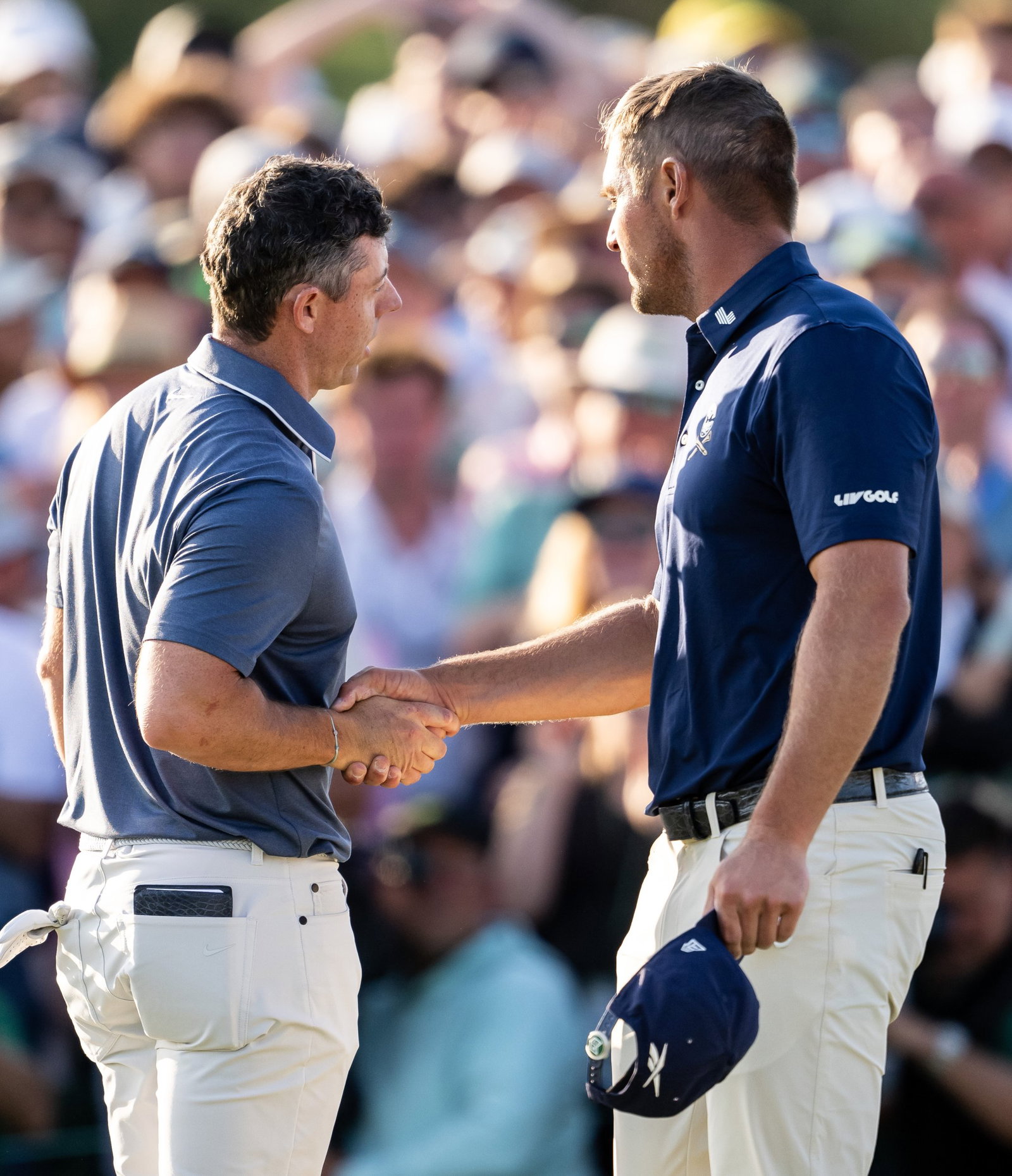 McIlroy and DeChambeau shake hands on the 18th