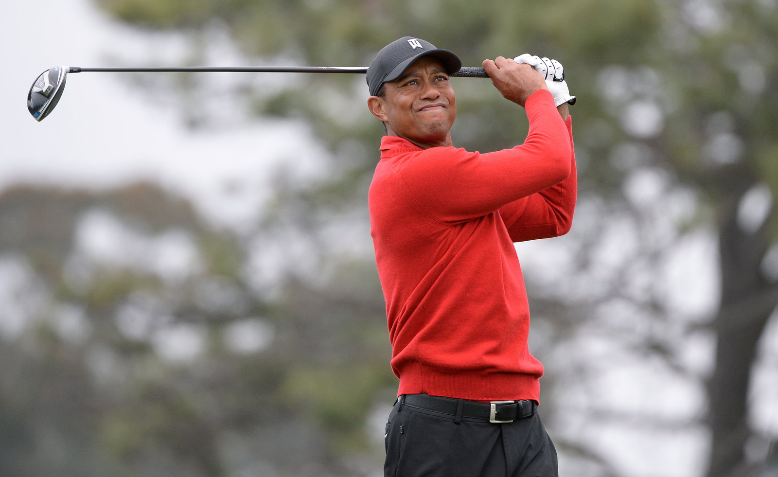 WATCH: Tiger Woods hits unreal shot that bounces out of the hole!