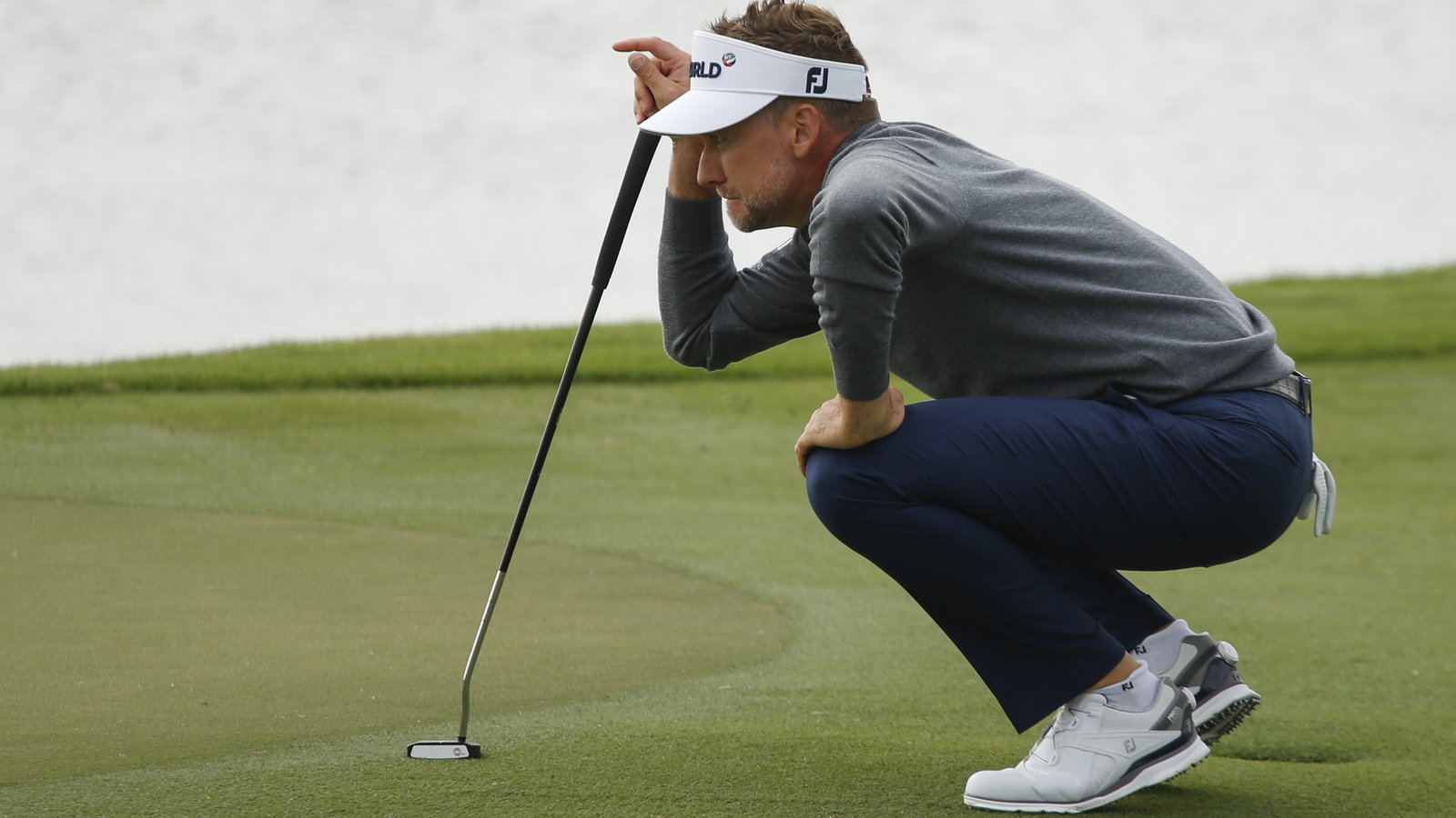 Ian Poulter shares the lead as McIlroy struggles