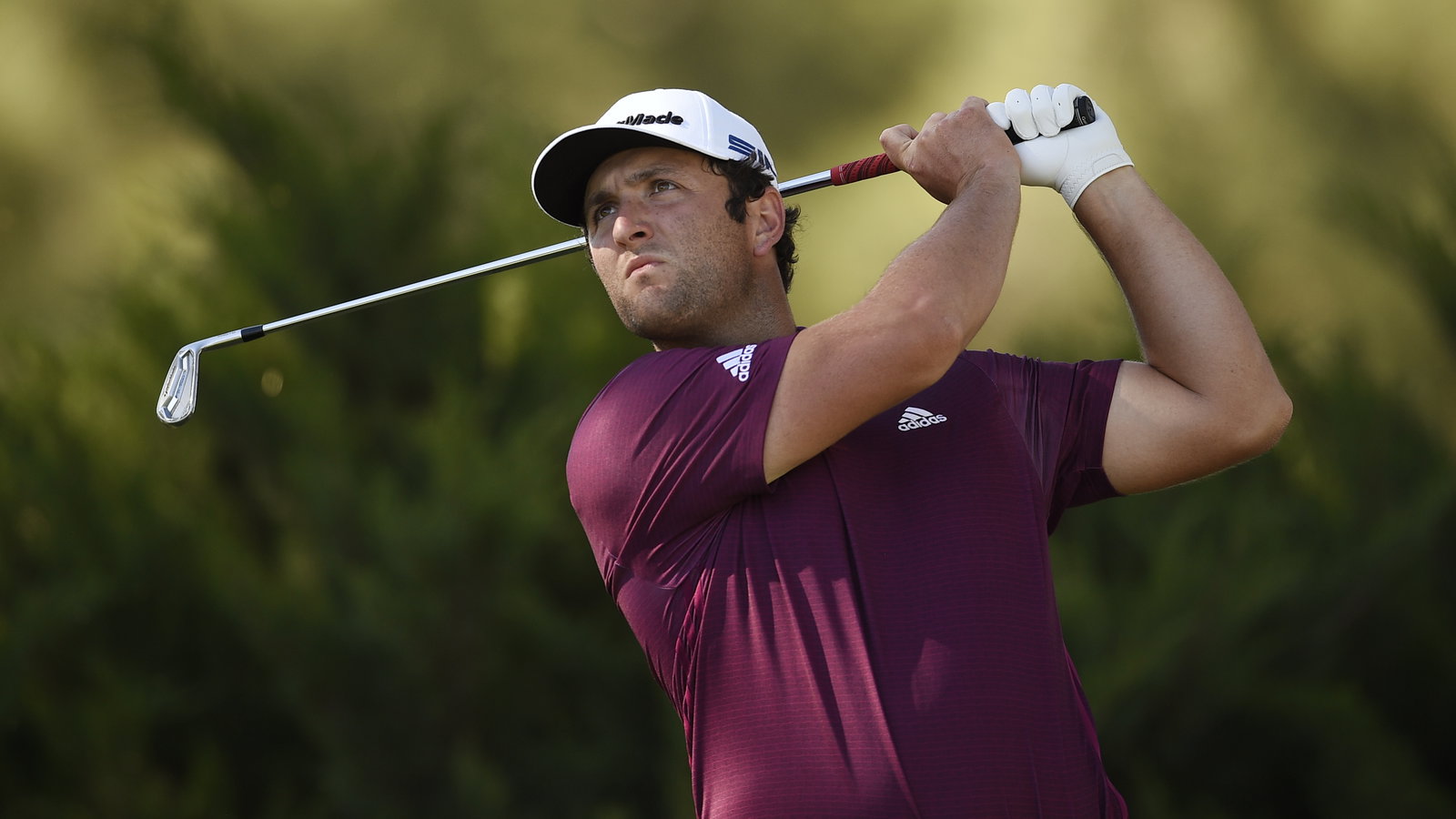 Jon Rahm fishes for his glove OUT A BIN during CJ Cup opening round
