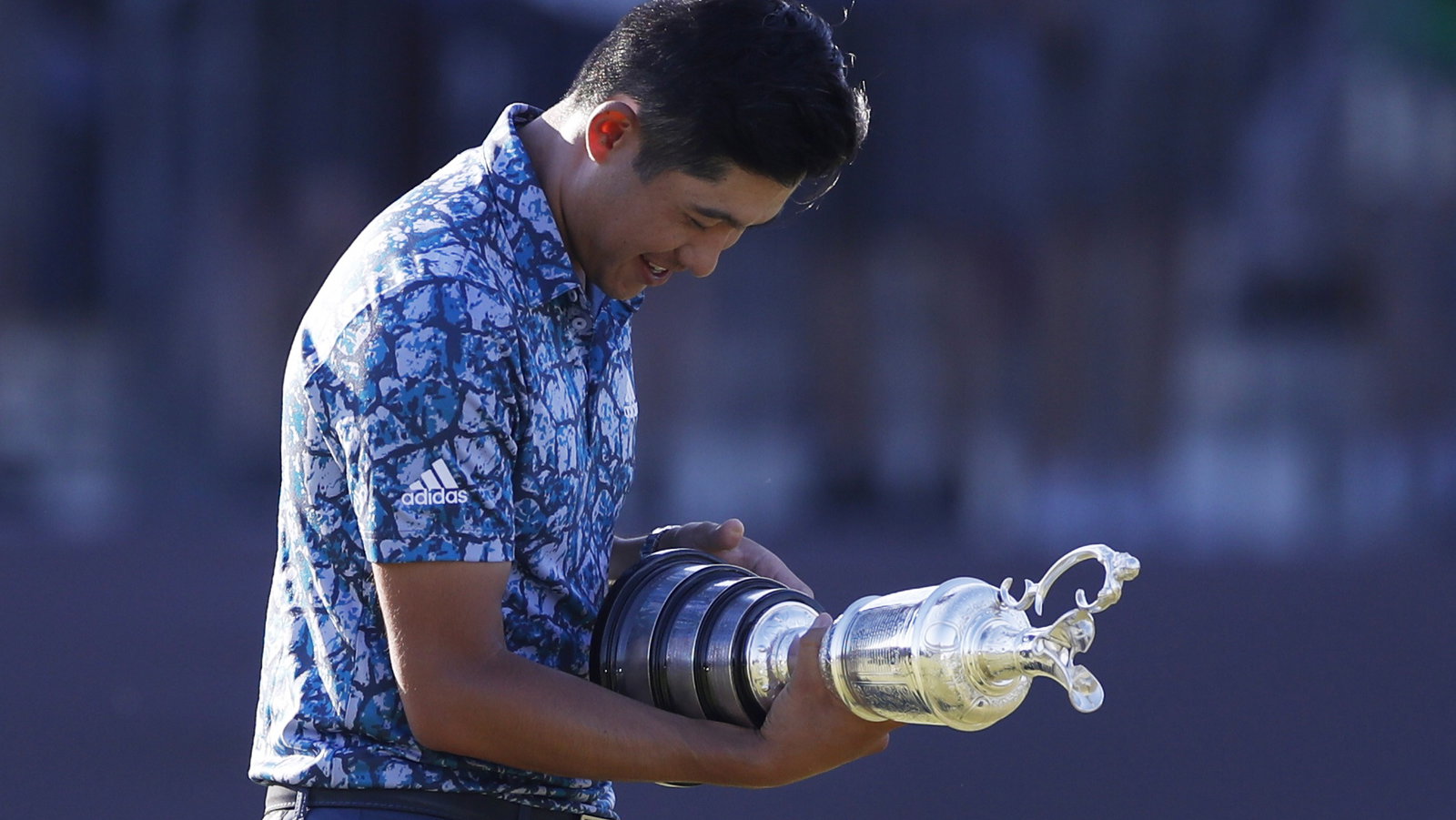 Open winner Collin Morikawa seen pulling CLARET JUG THROUGH AIRPORT on way home