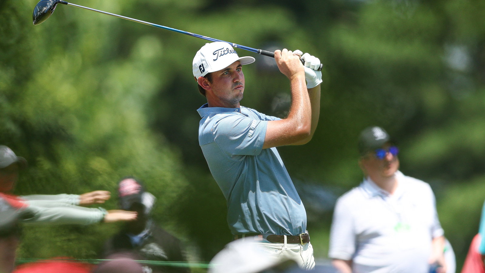 J.T. Poston goes low as Hoffmann avoids penalty for hitting his own hat