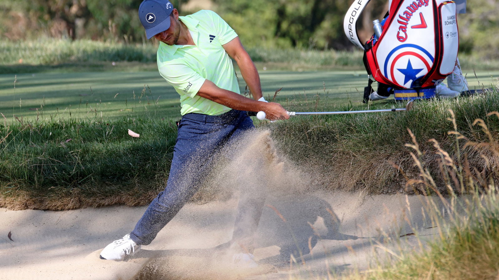 Watch Xander Schauffele take three (!) from a fairway bunker at the US Open