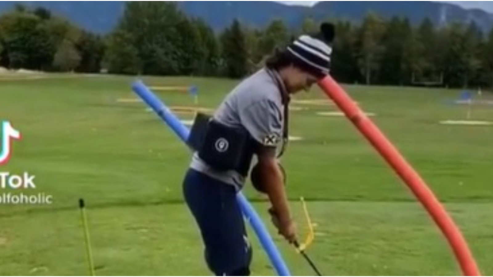 Paralysis by analysis: Amateur golfer goes a bit OVER THE TOP with training aids