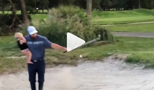 WATCH: Dad shows how to golf and parent at the same time!