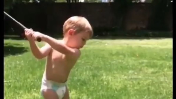 WATCH: This kid in a diaper probably swings it better than you! 