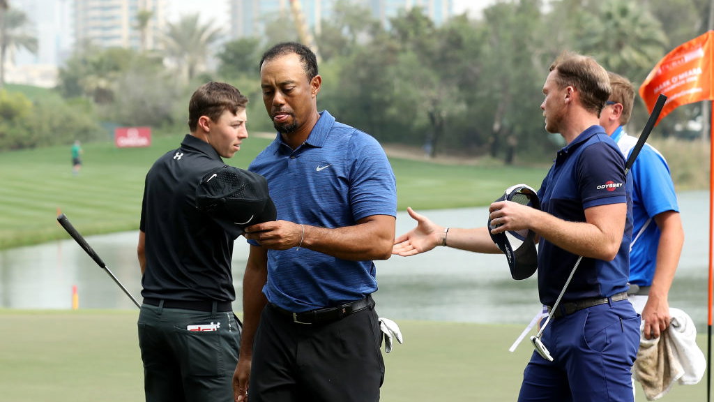 tiger woods withdraws from dubai with back injury