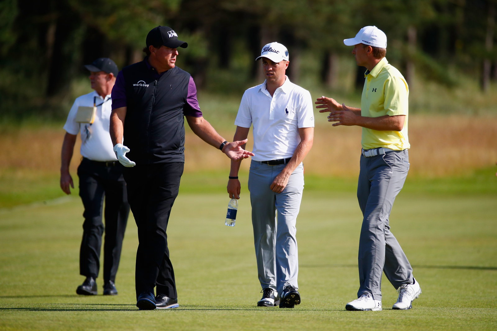 Justin Thomas plays a shot out of a bush, and still gets some spin! 