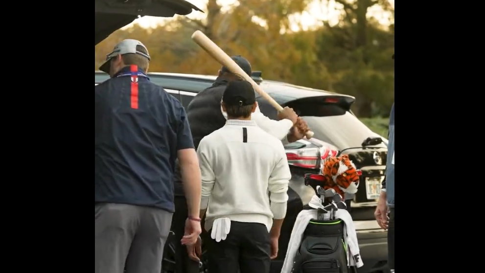 Tiger Woods swings BASEBALL BAT in car park as Charlie Woods walks with a LIMP