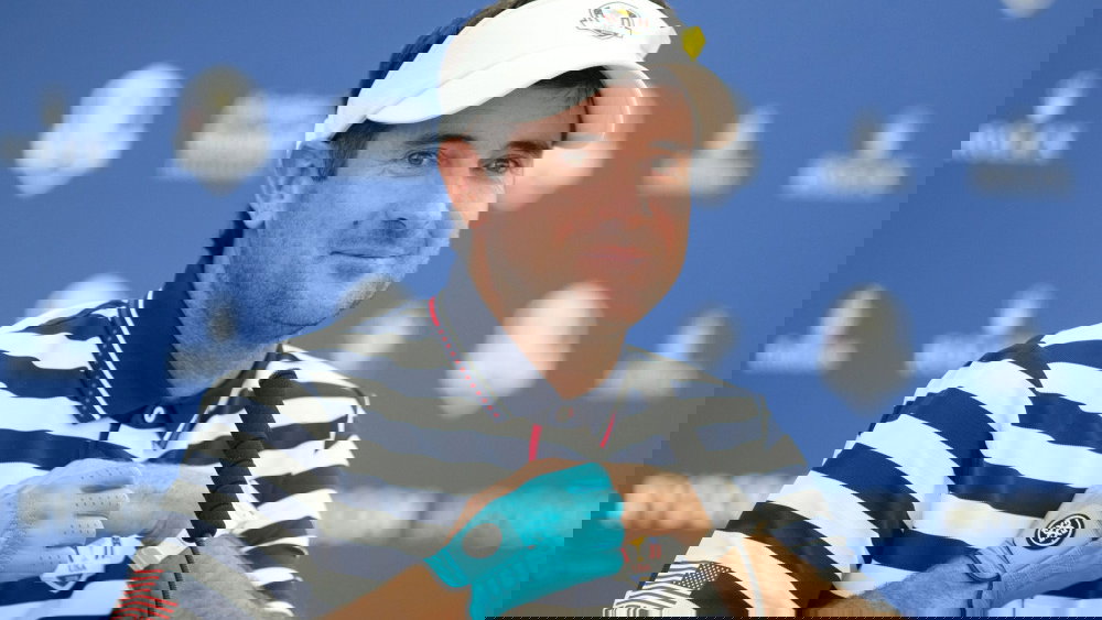 Bubba Watson wears blue glove during press conference at Ryder Cup