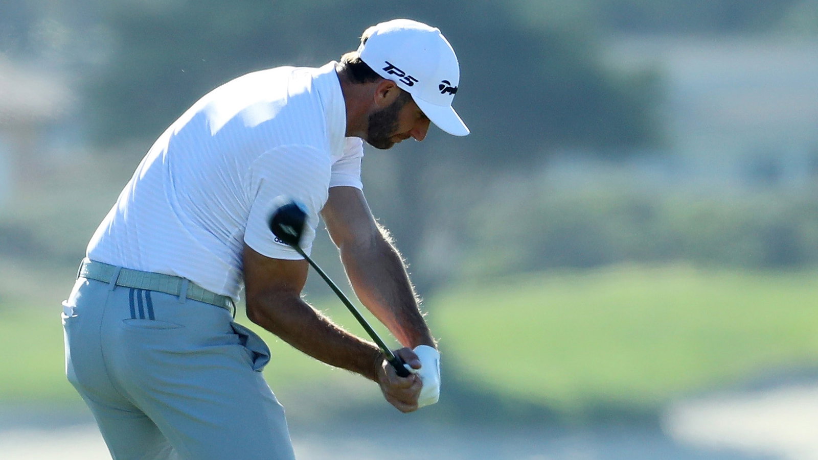 mimic the golf swings of dustin johnson and jon rahm to completely stop fatting it