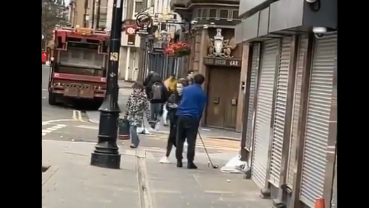OUTRAGE: Man SMASHES golf ball down busy Dundee high street!