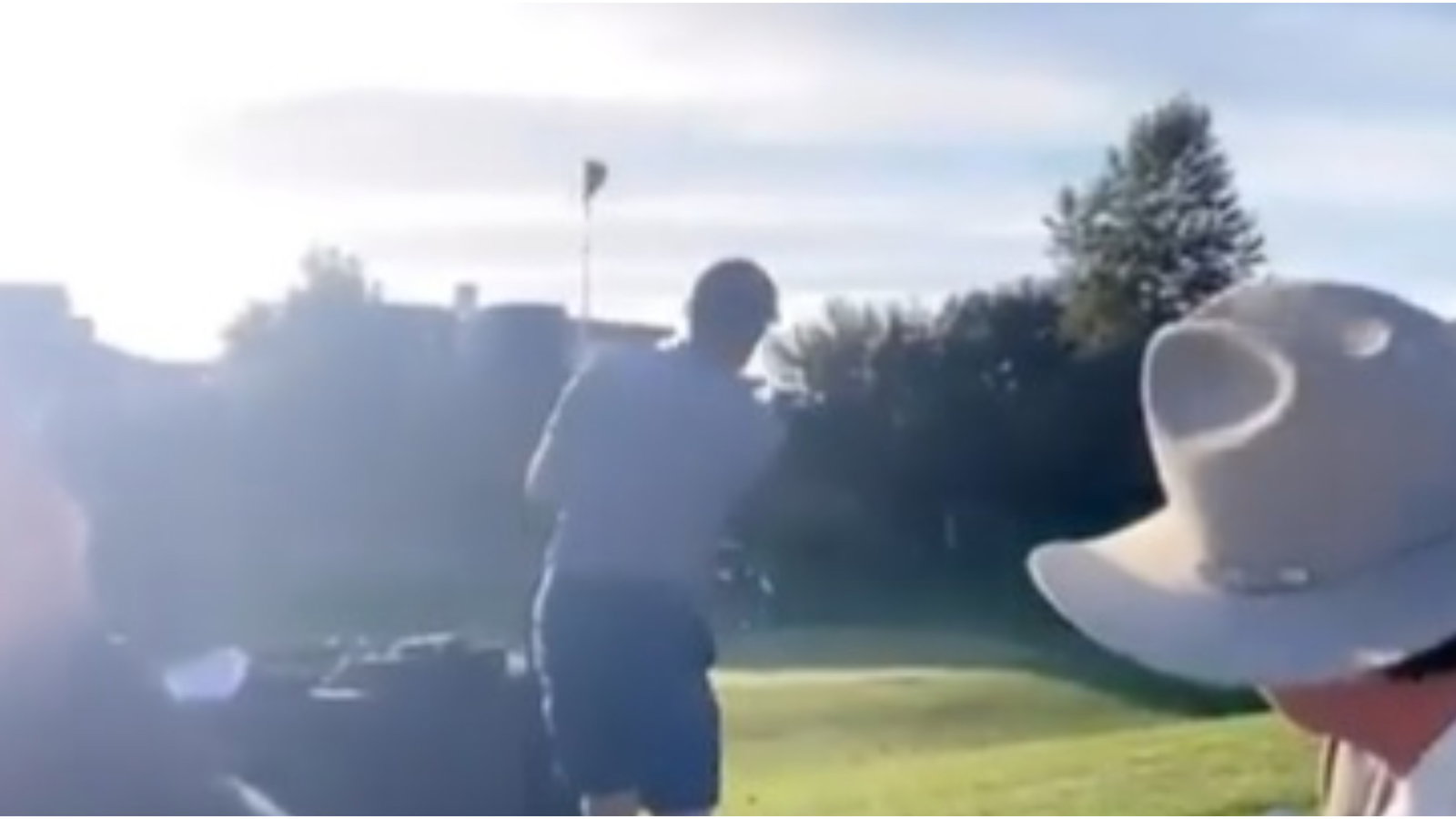 'I do': Golfer gate-crashes greenside WEDDING ceremony to play a chip shot