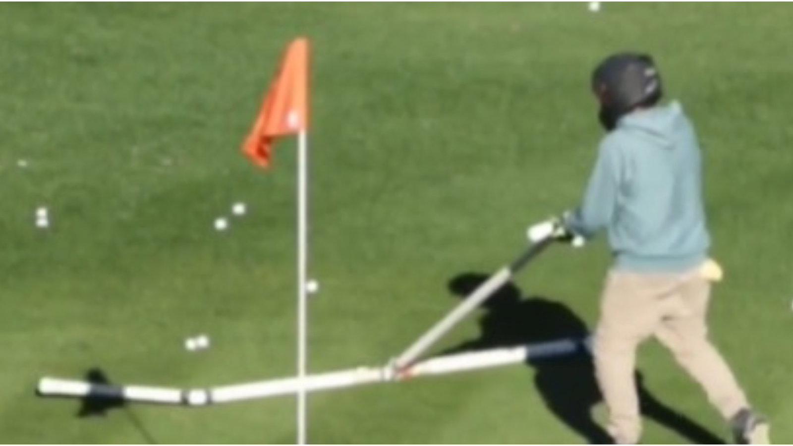 Is this the most DANGEROUS job in golf? 'The safest place is next to the target'