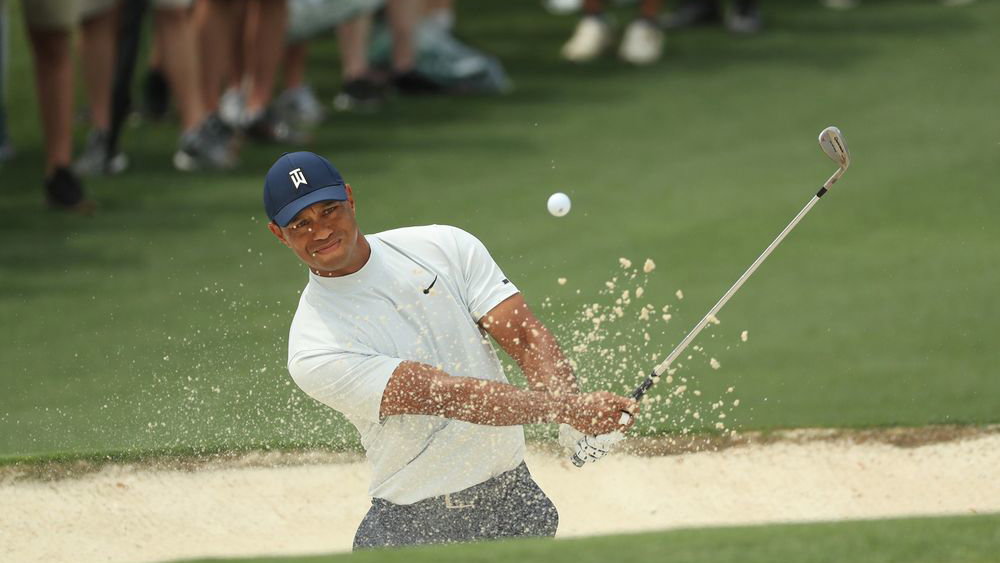 Tiger Woods shows off his strange but very effective bunker drill