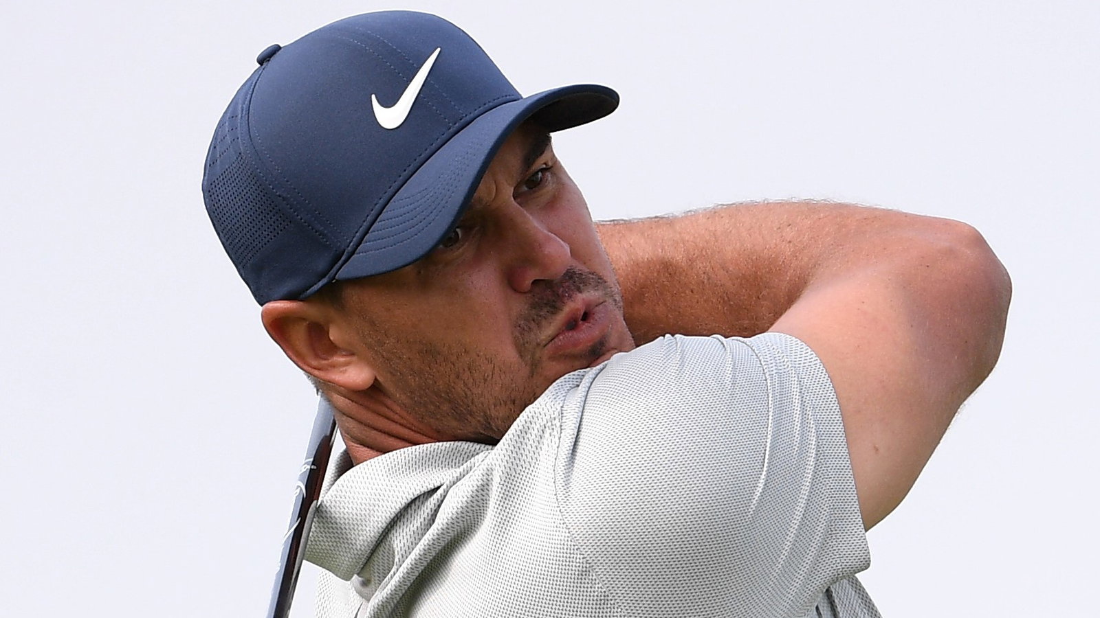 Brooks Koepka HOBBLES up the steps ahead of the US Open!