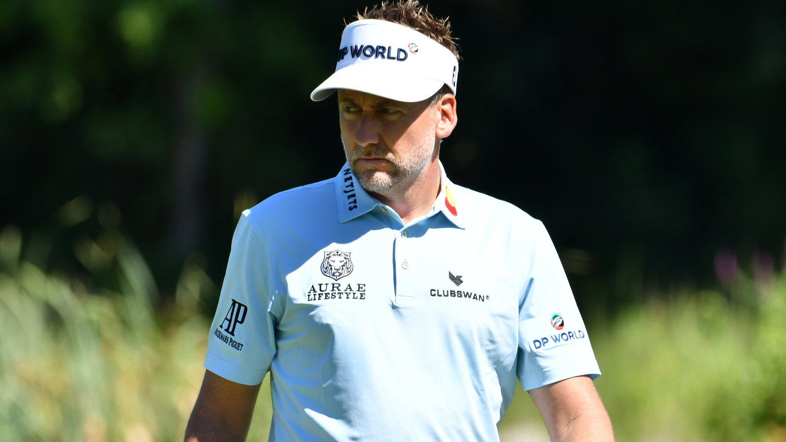 Ian Poulter chips golf ball through the strap of his expensive watch