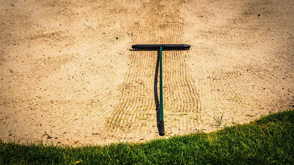 Golf clubs REMOVE RAKES and BAN FLAG CONTACT to combat coronavirus